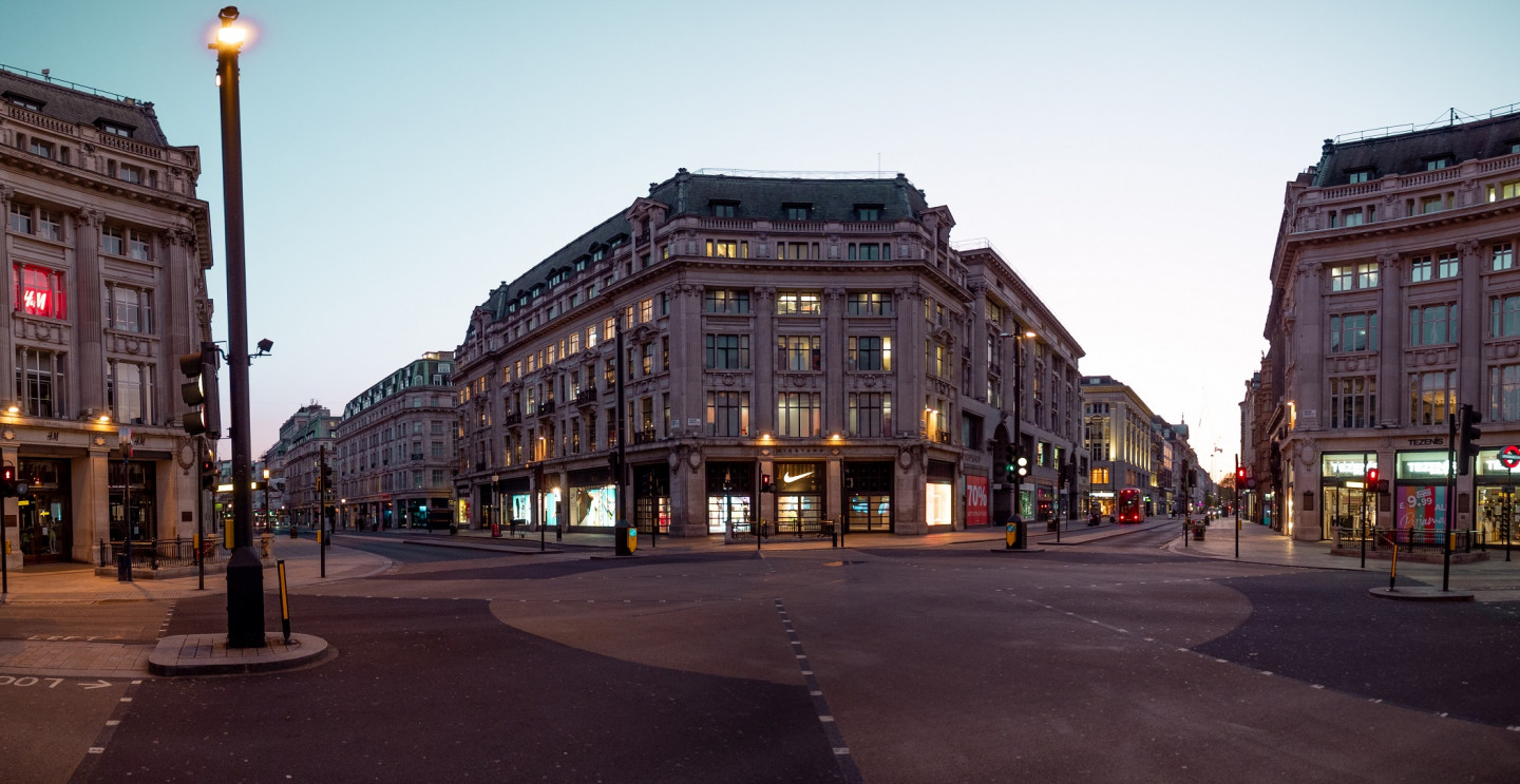 The start of rush hour at Oxford Circus in lockdown. Usually full of people coming up from the underground but not at the moment. The shops lights still hopeful that customers will come when the doors reopen. © John Mannell