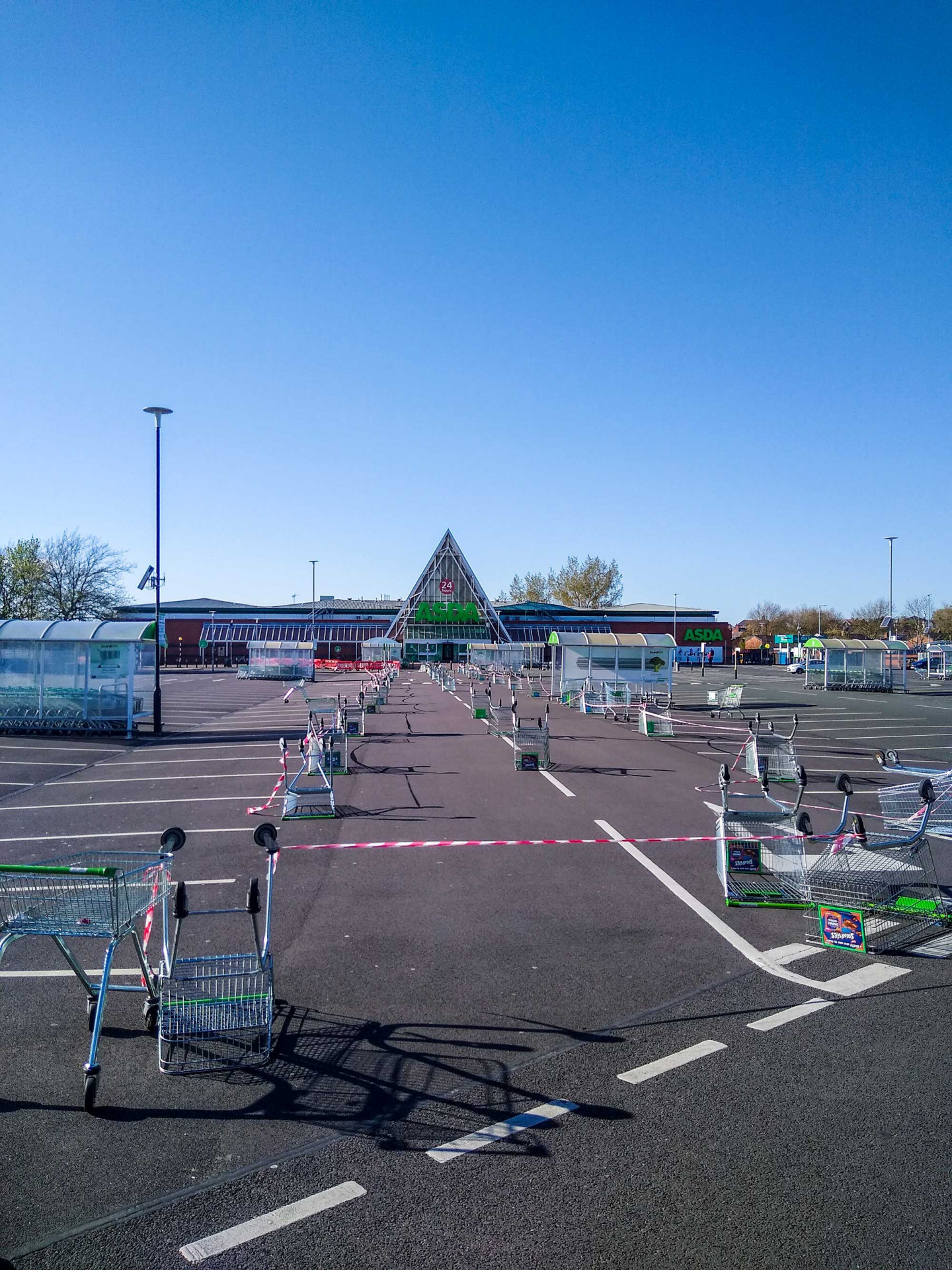 Asda. I took these images while driving through my home town of St Helens, Merseyside, just before I had to stay at home to self-shield as I have asthma.
 © Mark Peachey